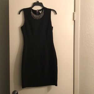 Black fitted dress.